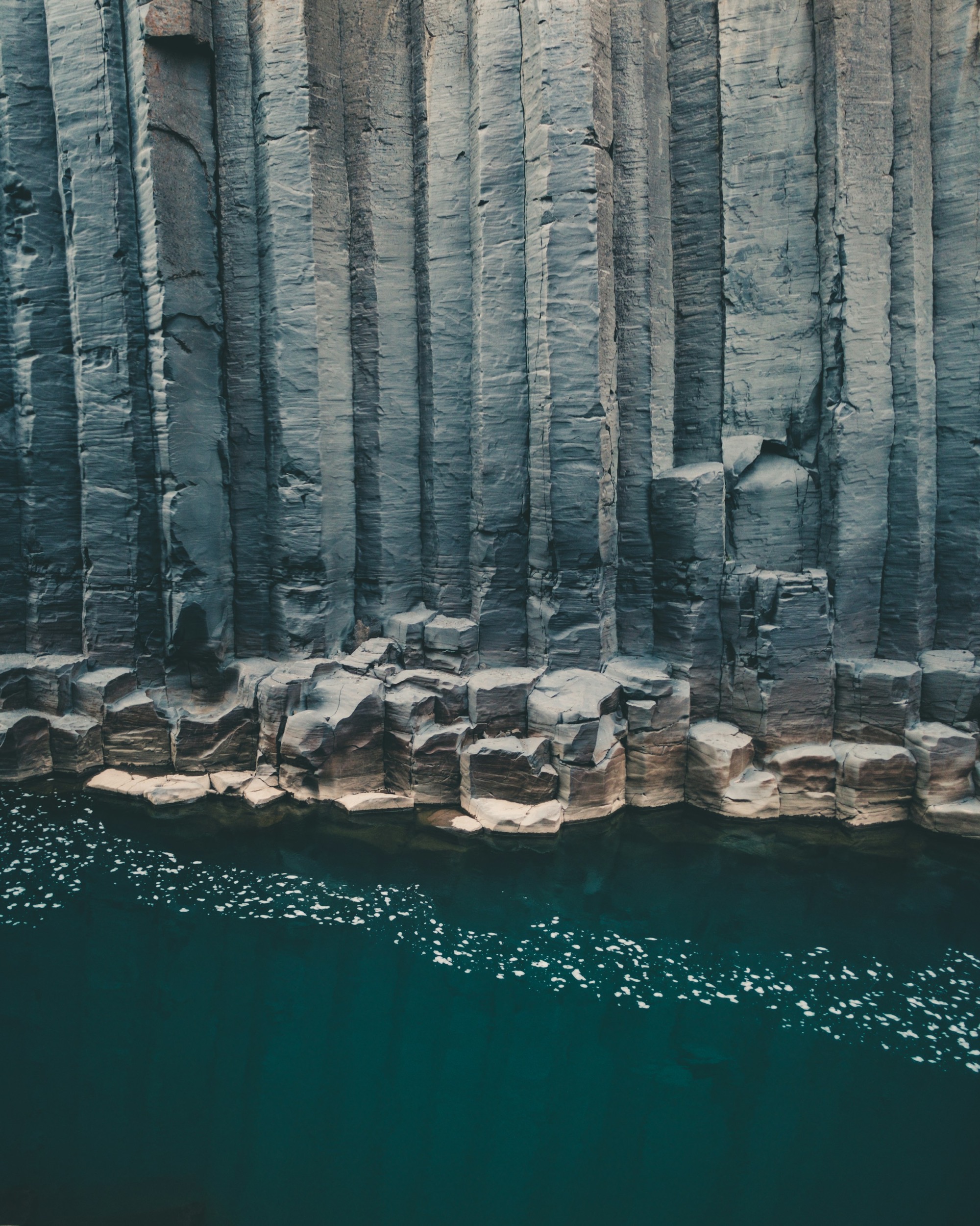 Basalt column tops seen from above, forming an interlocking polygonal pavement.