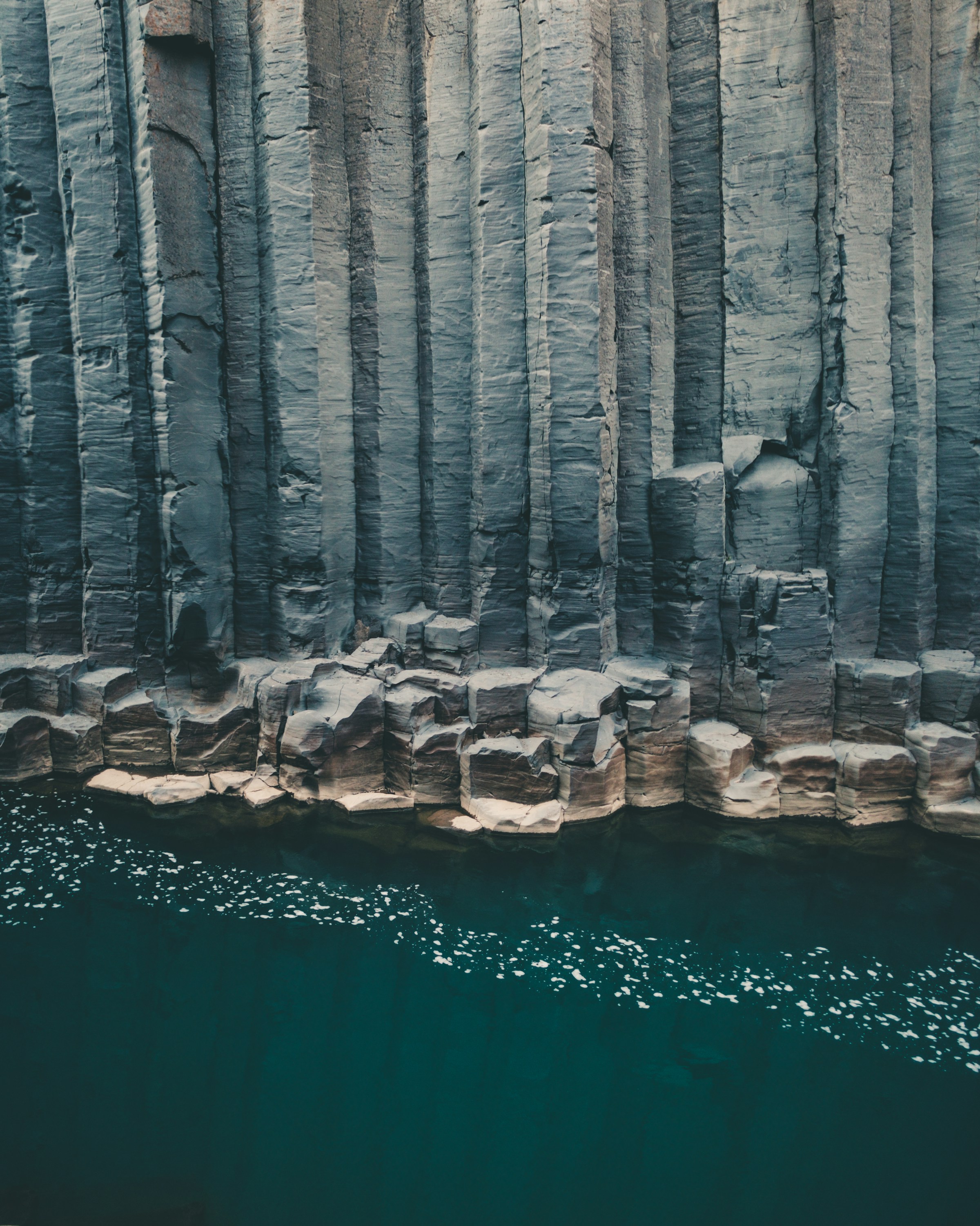 Basalt column tops seen from above, forming an interlocking polygonal pavement.